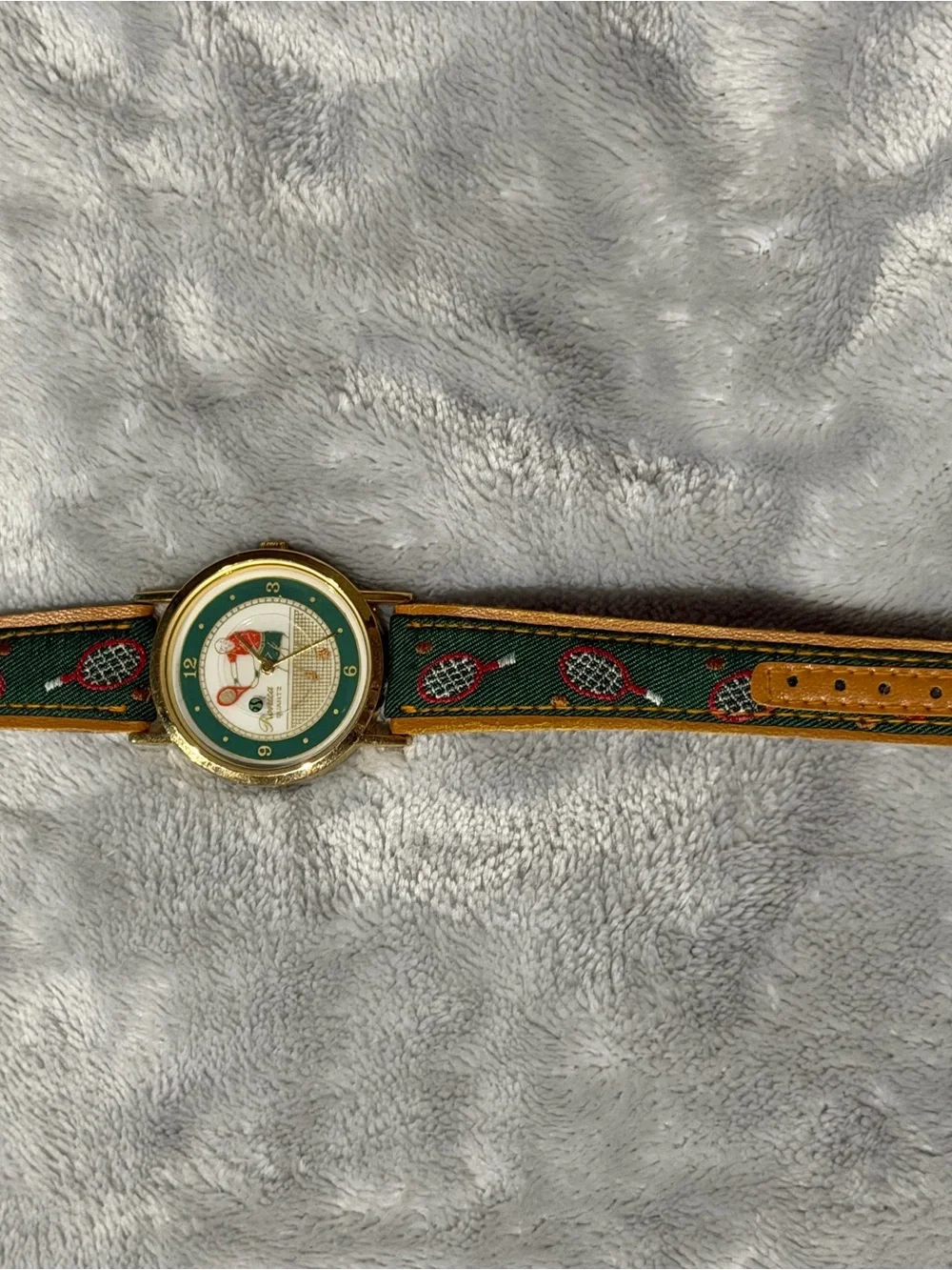 Tennis Motif Gold-Tone Watch with Green Dial Accents